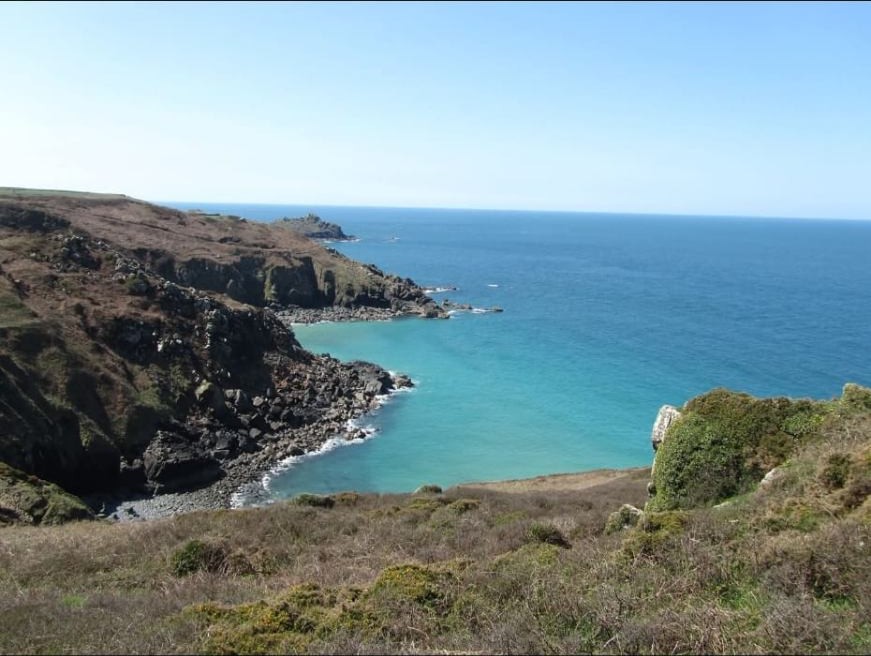 Turquoise sea and granite cliffs at a Cornish cove